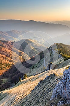 Sunny evening over mountains valley