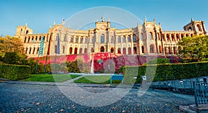 Sunny evening view of Maximilianeum, Home of the Bavarian State Parliament, with interiors viewable by guided tour only and a park