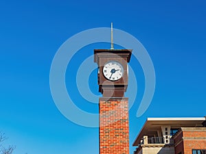 Sunny exteior view of the clock tower of Oklahoma State University