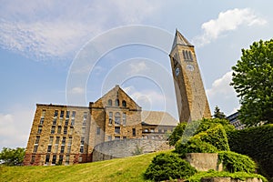 Sunny exterior view of Uris Library and McGraw Tower of Cornell University