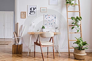 Sunny home office space with stylish furnitures and accessories.