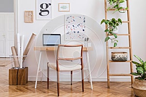 Sunny home office space with stylish furnitures and accessories.