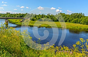 A sunny July day in a park on the banks of the Luga River in Kingisepp, photo