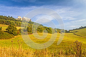 Sunny landscape with a ruins of medieval castle Lietava