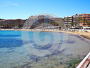 Sunny Mediterranean popular beach Torrevieja, Valencia, Spain