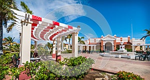 Sunny mid-day in Varadero, Cuba. Coloruful terraces at a resort hotel. - getaway on vacation in Cuba.
