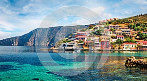 Sunny morning cityscape of Asos village on the west coast of the island of Cephalonia, Greece, Europe. Colorful spring sescape of