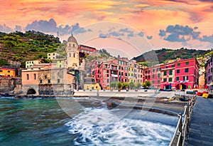 Sunny morning cityscape of Vernazza port with Santa Margherita di Antiochia Church. Colorful summer scene of Liguria, Cinque Terre