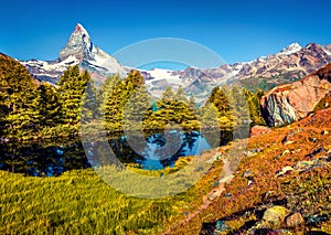 Sunny morning scene of Grindjisee lake. Bright summer view of Matterhorn Monte Cervino, Mont Cervin peak in Swiss Alps, Zermatt