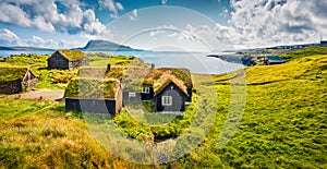 Sunny morning view of typical turf-top houses. Panoramic summer scene of outskirts of Torshavn city, capital of Faroe Islands, Kin