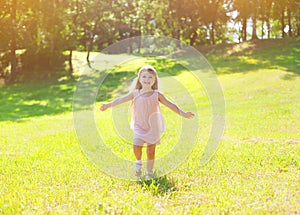 Sunny photo happy little child enjoying summer day