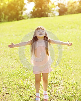 Sunny photo happy little girl child enjoying summer day