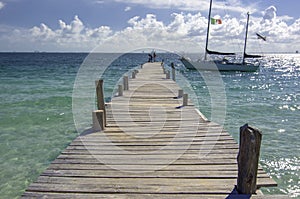 Sunny Pier with Docked Sailboat in Mexico