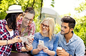 Sunny scenery of a group of young friends having fun in a park