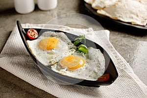 Sunny Sider Egg served in a dish isolated on grey background side view fast food