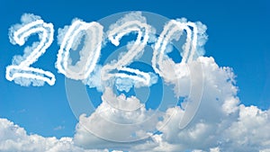 Sunny sky cloud year 2020. Happy New year concept. Numbers 2020 symbol inscription on background of blue sky from white smoke of