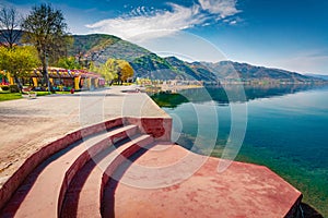 Sunny spring cityscape of Pogradec town. Stunning morning scene of Ohrid lake.