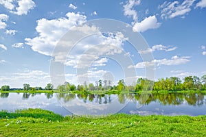 Sunny spring landscape water river blue sky clouds
