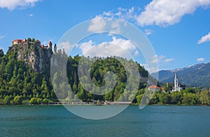 Sunny spring morning at Lake Bled and old medieval castle on the rock, famous tourist attraction in Slovenia