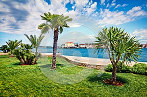 Sunny spring view of popular summer resort Porec. Colorful spring seascape of Adriatic Sea. Stunning morning scene of Istrian