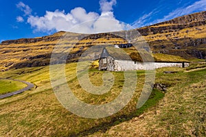 Sunny spring view of Saksun village with typical turf-top houses, Faroe Islands