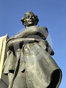 A sunny statue of a cross-armed Julius SÃâowacki in Ukraine photo