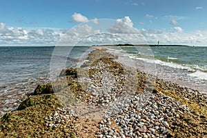 Sunny summer day by Baltic Sea copy space for text travel agency.Wandelust Travel background.Power of water energy passing.Amazing