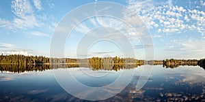 Sunny summer day on a forest lake