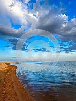 Sunny summer day on the lake. Mountains and sea. Kyrgyzstan, Lake Issyk-Kul