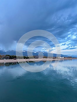 Sunny summer day on the lake. Mountains and sea. Kyrgyzstan, Lake Issyk-Kul