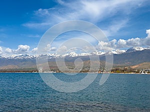 Sunny summer day on the lake. Mountains and sea. Kyrgyzstan, Lake Issyk-Kul