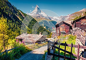 Sunny summer morning in Zermatt village with Matterhorn Monte C