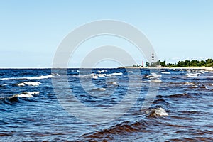 sunny summer scene of Baltic sea with beautiful seaside with waves