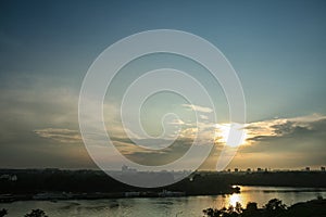 Sunny summer sunset over usce, the confluence between the sava and the danube dunav river and the panorama of New Belgrade