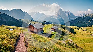 Sunny summer view of Sassolungo Langkofel range in National Park Dolomites, South Tyrol, Italy, Europe. Attractive morning scene