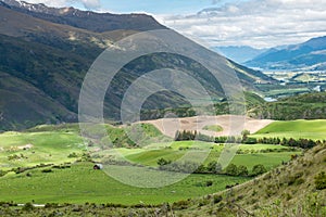 Sunny valley view from the Crown Range Road Scenic Lookout Point near Queenstown