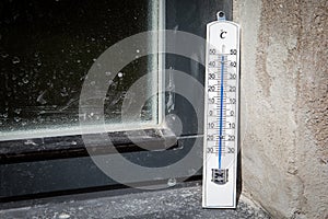 Sunny and very extreme hot weather. Dirty outdoor windowsill. Outdoor thermometer