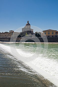 Sunny view of Church San Frediano in Cestello and river Arno