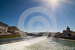 Sunny view of Church San Frediano in Cestello and river Arno