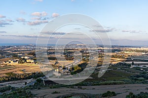 Sunny view at golden hour of surrounding fields from tower of Mdina