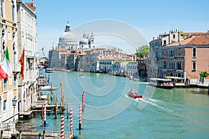 A sunny view of a Grand Canal, near the Venice Santa Lucia Railway Station from top of Scalzi Bridge