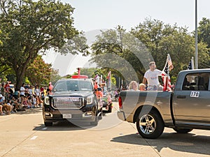 Sunny view of a July 4th community parade in Dallas