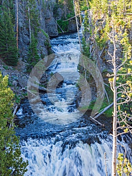 Sunny view of the Kepler Cascades in Yellowstone National Park