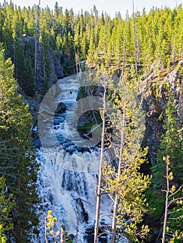 Sunny view of the Kepler Cascades in Yellowstone National Park