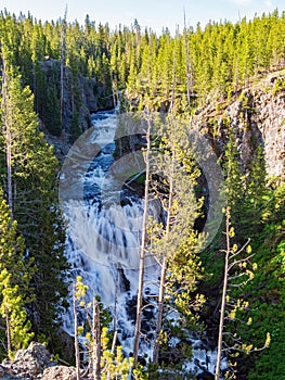 Sunny view of the Kepler Cascades in Yellowstone National Park