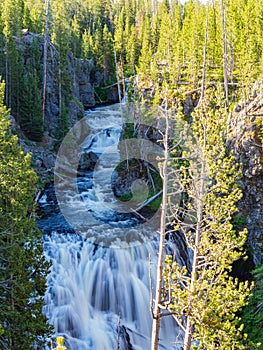 Sunny view of the Kepler Cascades in Yellowstone National Park