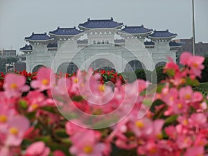 Sunny view of the Liberty Square Arch with many flower blossom