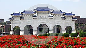 Sunny view of the Liberty Square Arch with many flower blossom