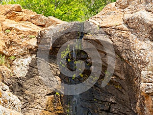 Sunny view of the Post Oak Waterfall landscape of Wichita Mountains