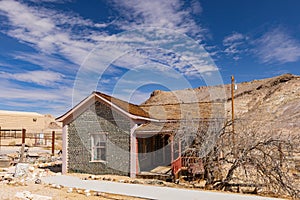 Sunny view of the Tom Kellys Bottle House